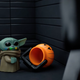 The Mandalorian catches Grogu with Halloween candy smeared all over his face.